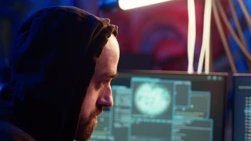 Hooded Hacker Targeting Vulnerable Unpatched Connections Close Up