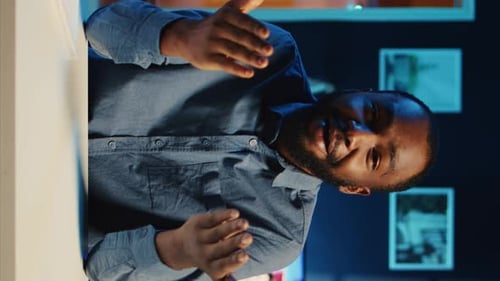 Man Talking on Video Conference in Office