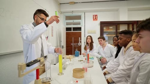 Instructor Demonstrates Science Experiment to Attentive Students