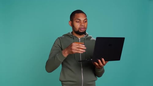 Man Adding Payment Method on Website Using Laptop