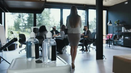 Safety at Office Workplace After Coronavirus Closeup Business People Use Hand Sanitizer Coming to