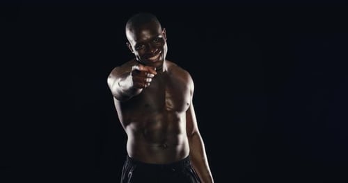 Shirtless Muscular Man Flexing and Smiling