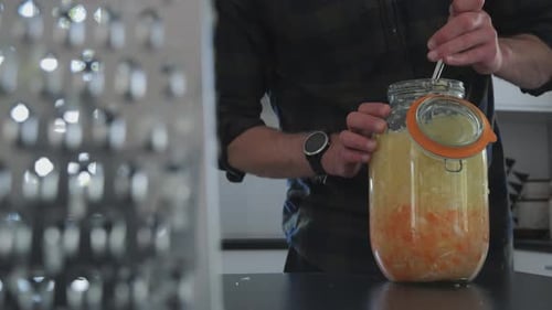 Person prepares Sauerkraut at home, fementation process series part 4