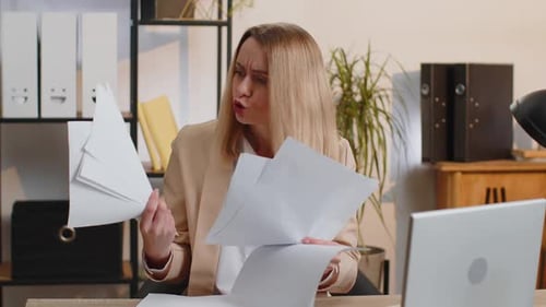 Stressed Businesswoman Work at Unpaid Bank Debt Doing Paperwork Planning Budget Throws Paper Bills