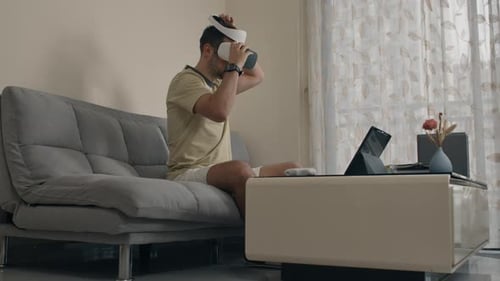 Man Using VR Headset at Home
