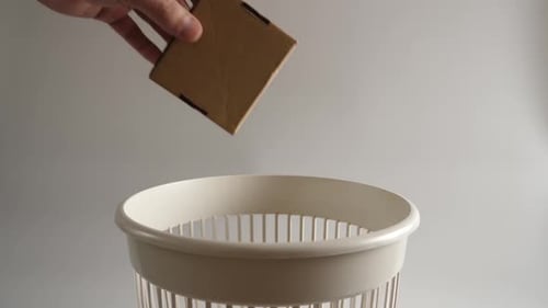 07. Cardboard packaging is thrown into the trash for recycling