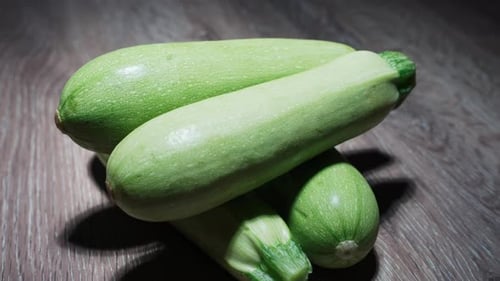 Fresh Green Zucchini on Wooden Table
