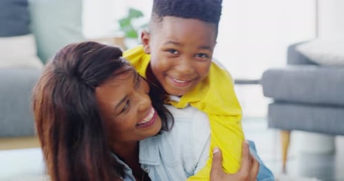 Happy Child Hugging Adult in Sunny Home