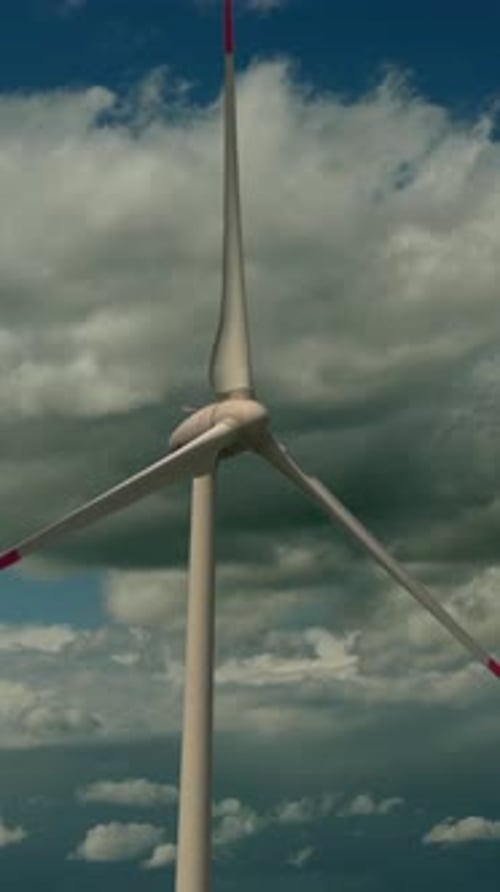 A Wind Turbine in Front of a Dramatic Sky Makes for a Fascinating Scene and View