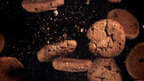 Chocolate Chip Cookies Falling Deliciously on Black Background
