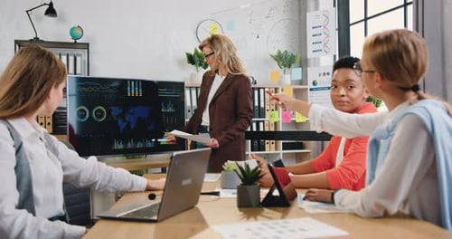 Business Meeting in Modern Office with Four Women