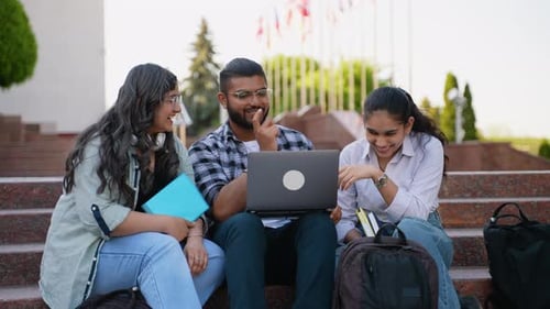 Students Sitting on Stairs in Campus with Laptop and Study Together