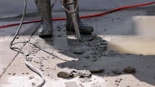 Jack Hammer breaking up concrete.