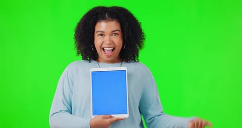 Woman, tablet and excited for mockup on green screen while pointing finger for wow deal