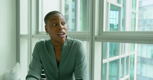 Businesswoman and Businessman Meeting in a Office using Laptop Technology