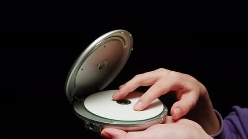 Vintage Cd Music Player Closeup Using Portable Music Player for Listening with Compact Disc