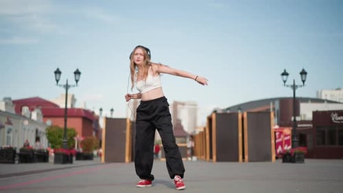 Dynamic Hip Hop Dancer Performs Lively Routines in Open Urban Space Vibrant Street Performer
