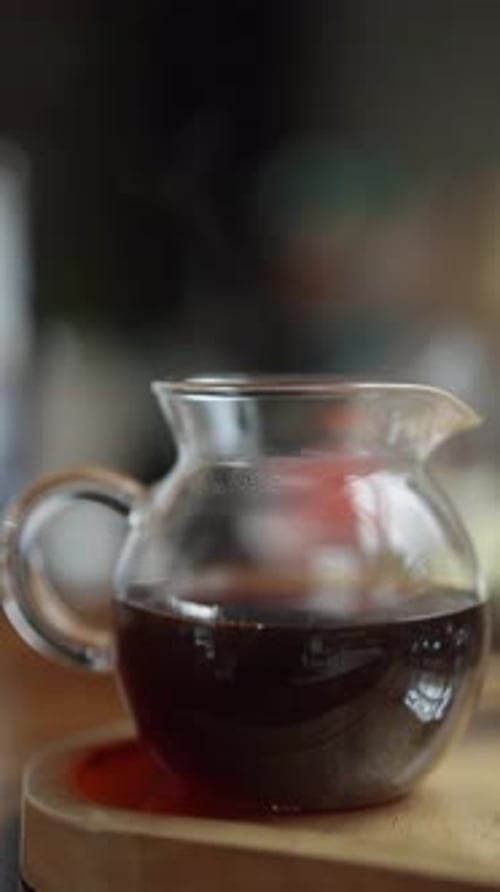 Glass Jar with Steaming Liquid Beverage