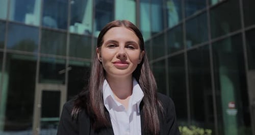 Portrait of a Young Woman in a Black Suit Looking to Camera Outside on Street Businesswoman Portrait