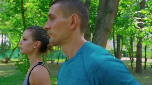 Couple Jogging in Park