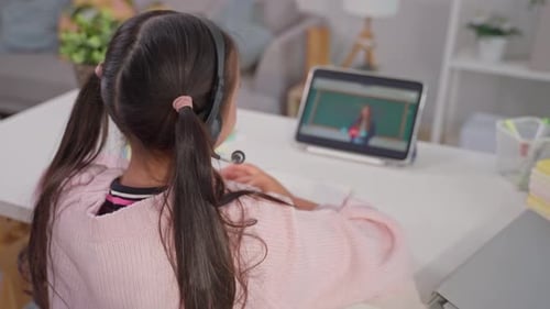 Student Learning Online From Home With Tablet