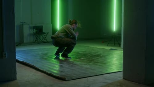 Young Talented Breakdancer Performing Stunning Breakdance Indoors