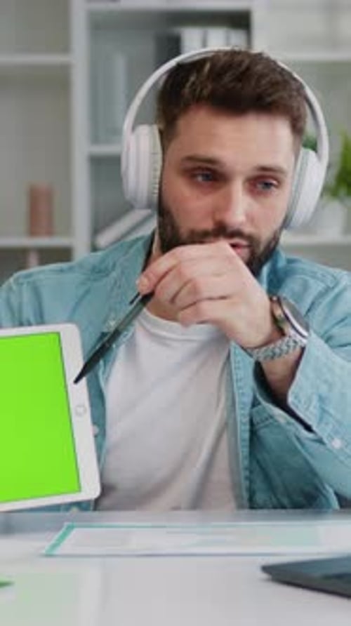 Focused Business Man Sit at Desk Makes Videocall Conference Speech and Showing Green Screen Digital