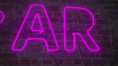 Animated Neon Light Party Word Reveal on Brick Wall
