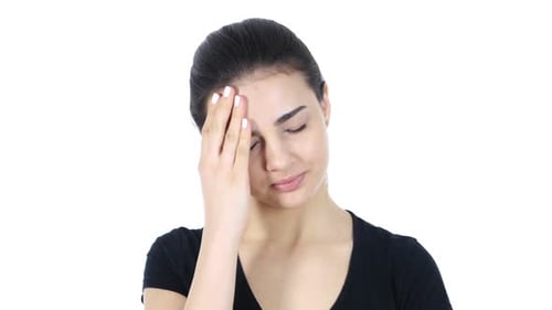 Young Woman Experiencing Headache Pain, Close Up