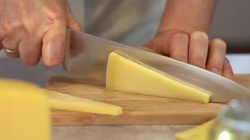 Hands Cut with Knife Parmesan Cheese on Wooden Cutting Board Farm Dairy Food