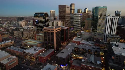 Aerial over the Denver skyline at dusk, Colorado, USA. Drone orbit shot