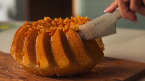 Knife Cutting Into Glazed Easter Bundt Cake Revealing Soft Interior