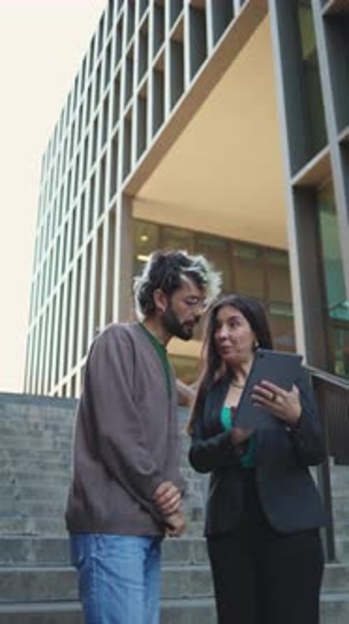 Team Reviewing Data on a Tablet Outdoors