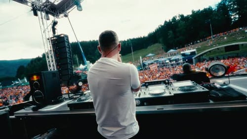 Dutch Angle Shot Of DJ At OpenAir Concert