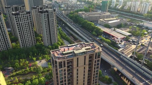 Aerial Views Capture a Vibrant City Skyline with Towering Buildings and a Busy Highway