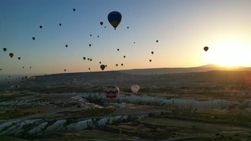 Hot Air Balloons Floating over Cappadocia at Sunrise