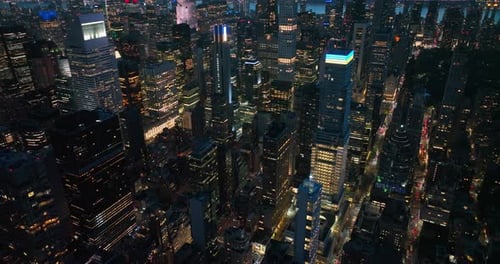 Never sleeping New York at night time. Numerous lights of skyscrapers