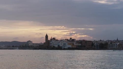 The City Skyline on Sunset Near the Water A Few Clouds on the Sky