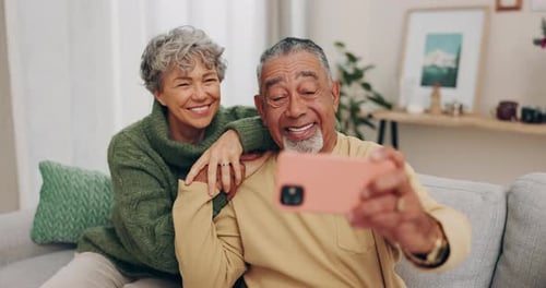 Senior Couple Taking a Selfie at Home