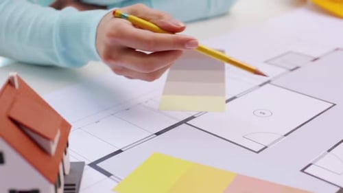 Architects Discussing Home Blueprint Design