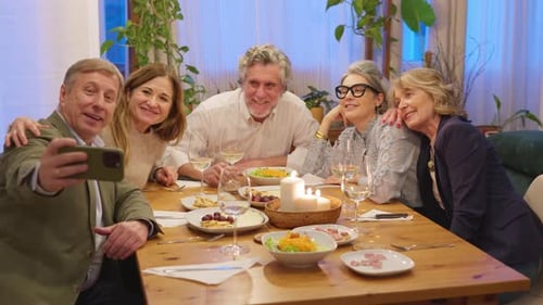 Group of Friends Taking Selfie at Dinner Party
