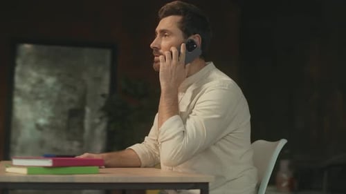 Man Talking on Cell Phone in Bright Modern Office