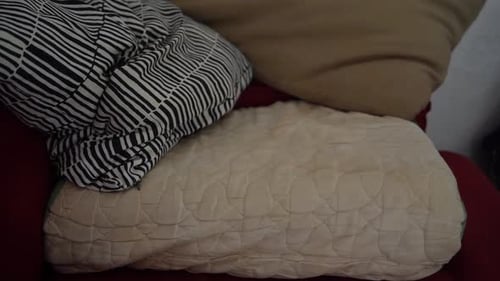 Dirty pillow with stains, Old pillow with yellow stains. Dirty yellow-brown stains appear on fabric.