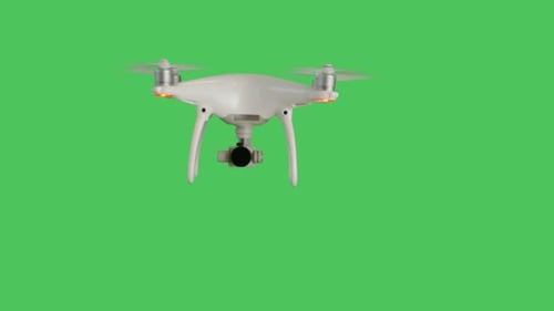 Drone with a Camera Flying. Background is Green Screen.