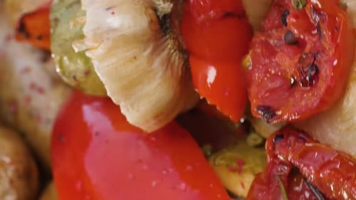 Vertical Video Portion of Grilled Sausages on Pita Bread with Baked Zucchini Tomatoes Garlic Paprika