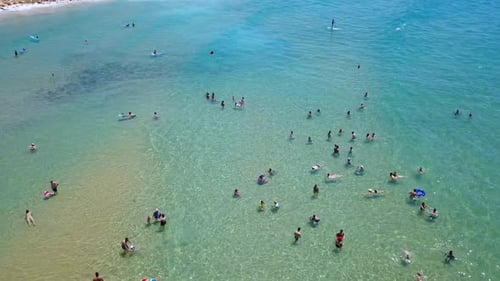 aerial footage of People enjoying the calm water of The Mediterranean Sea.