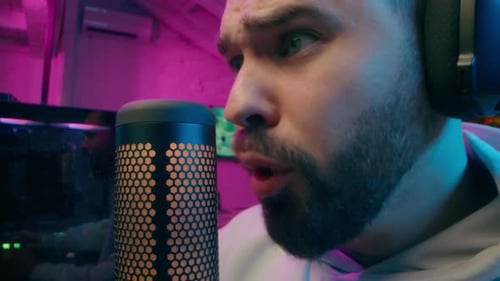 Close Up Upset Caucasian Vlogger Male Host Gamer Guy Broadcasting Radio Microphone Addict Man