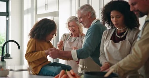 Family Preparing Food Together in Bright Modern Kitchen