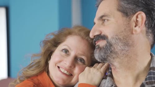 Loving Couple Together at Home Smiling Contentedly