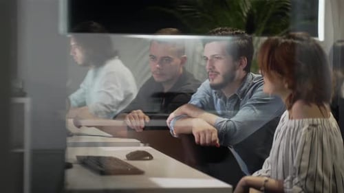 Men and Woman Colleagues Discuss Online Project Look at Pc Screen Mentor Teaches Young Man Explains